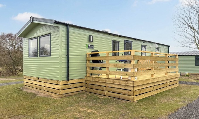 Castle Douglas House | 12ft-wide caravan situated in a coastal position.