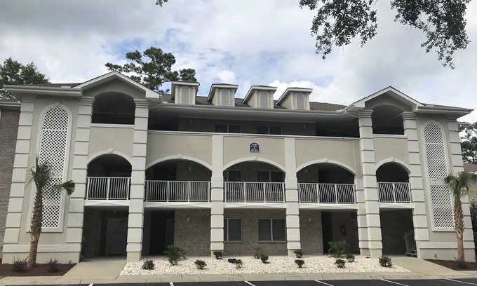 Sunset Beach Condo | 1st floor 2 BR, 2 BA Condo close to Beach & Golf Courses w/Indoor/Outdoor pools