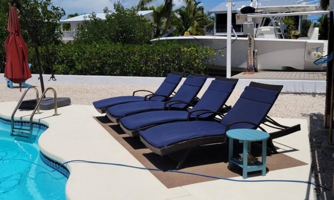 Breezeswept Beach Estates House | 3/2 two story home with pool and 80' dock on canal ocean side.