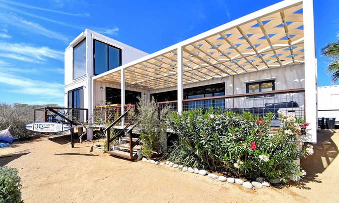 El Sargento House | 3 bedroom, 3 bath premium repurposed shipping container home with a Bullfrog X8 premium hot tub. Daily housekeeping (except Sundays) available for no additional fee. Free use of inflatable SUPs, beach chairs, a large sun shade & other beach toys.