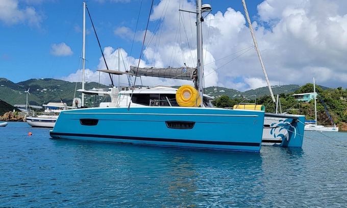 Morne Rouge Boat Rental | 44-foot Luxury Catamaran "SeAtitudes" at Grande Anse Beach in Grenada.