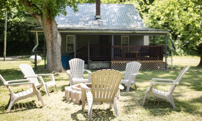 Sharpsburg House | 9511 Compressor Rd, Chesterhill, OH - Outdoor Movie Theater with Outdoor Kitchen and Games