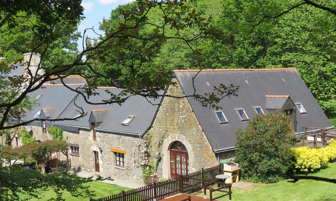 Plumeliau House | A Beautifully Restored Coach House With Heated Pool in large garden