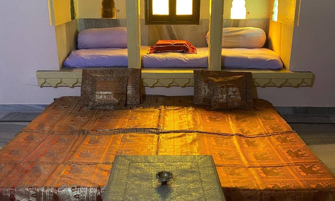Udaipur City Centre Bed & Breakfast | A heritage room in udaipur overlooing the city palace