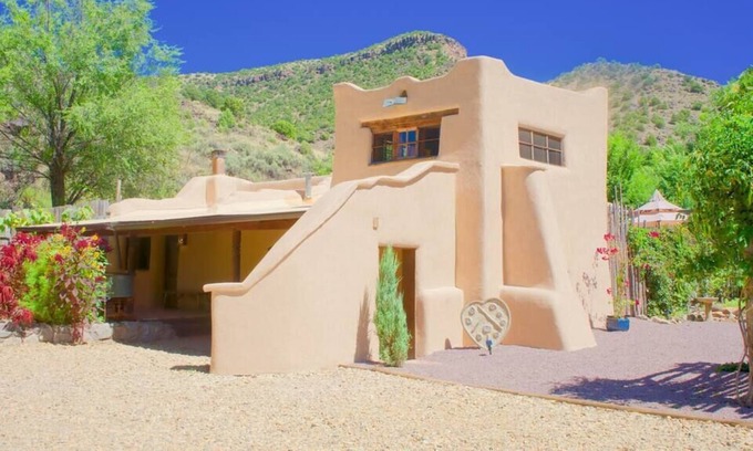 Pilar House | A romantic adobe, river retreat with outdoor tubs.