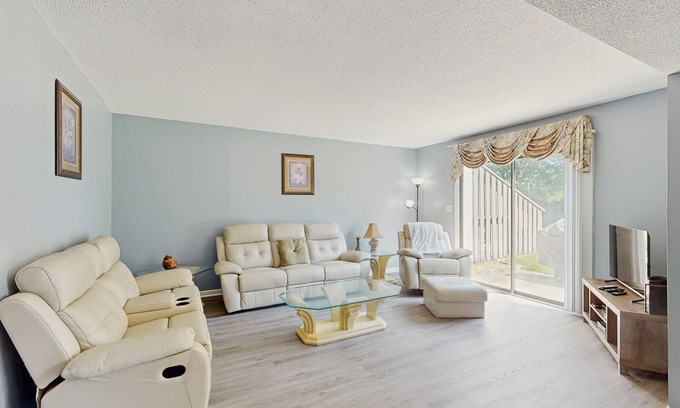 Little River House | All-suite Bay Tree retreat with al fresco dining, water views, and shared pool