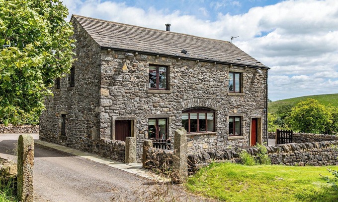 Fence Cottage | An 1800’s barn conversion with beams, exposed stonework and flagged floors.