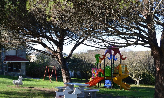 San Roman de la Llanilla Apartment | Apartment loft in chalet for 9 people garden barbecue playground beach