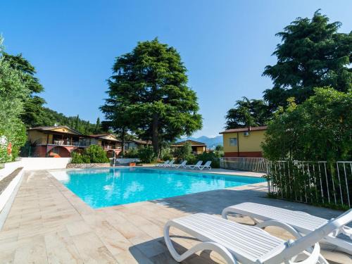 Villaggio Sanghen House | Apartment on Lake Garda with pebble beach pier for boat three swimming pools