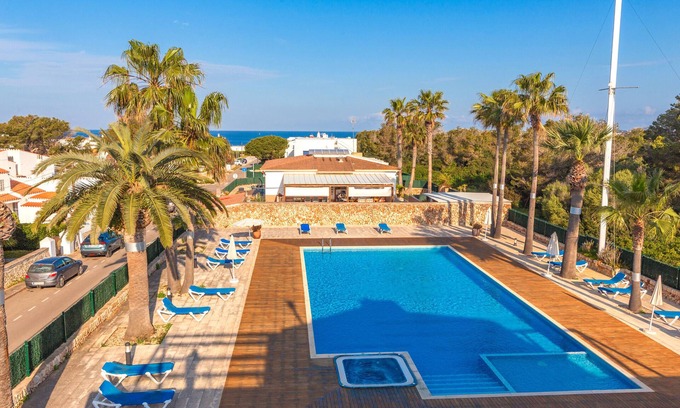 Cala Blanca Apartment | Apartment 'Sa Perdiu 24' with Sea View, Shared Pool and Air Conditioning