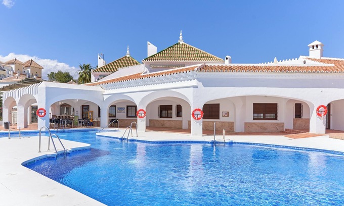 Chimenea Apartment | Apartment 'Sea View Nerja' with Shared Pool, Wi-Fi and Air Conditioning