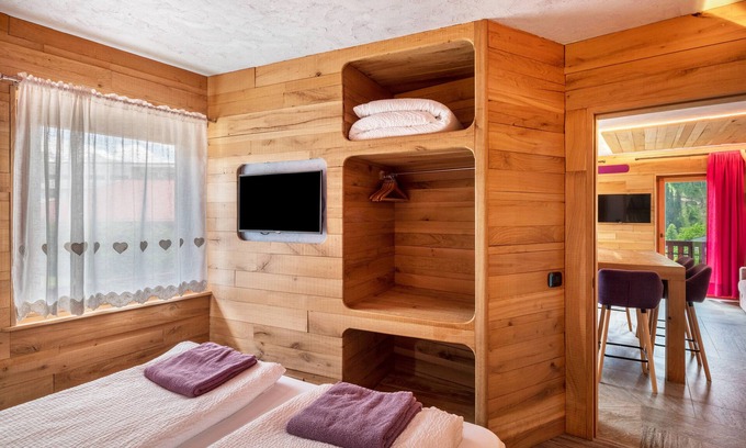 Pie Falcade Apartment | Apartment 'Tana Del Picchio Rosso' with Mountain View, Shared Garden and Wi-Fi