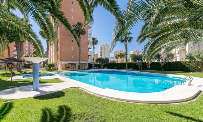 Playa de San Juan Apartment | Apartment 'Urbanización Bulevar Playa' with Shared Pool, Wi-Fi and Air Conditioning