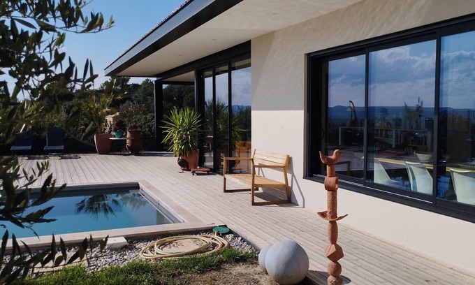 Mondragon House | Architect-designed house in a subdivision with views and a swimming pool not overlooked