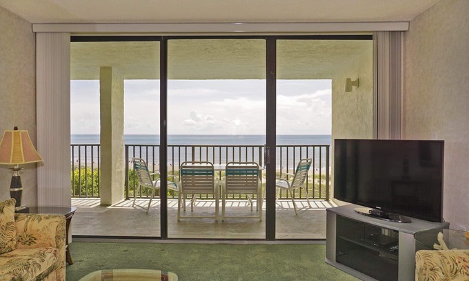 Port Canaveral Condo | BEACH FRONT TOP FLOOR w/Private Balcony - Master Bedroom & Living Room on Ocean