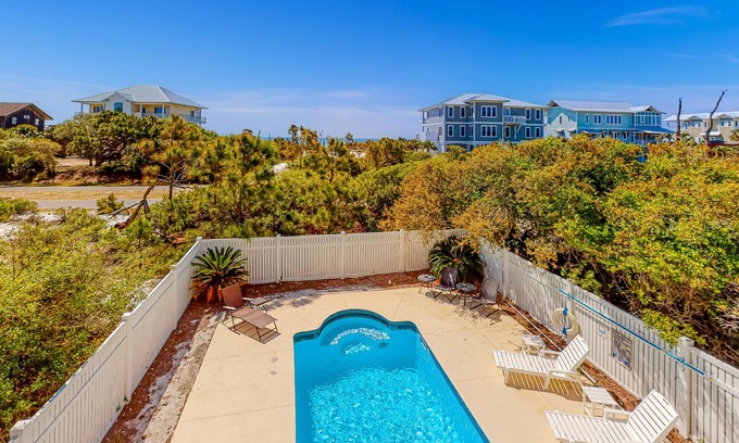 Treasure Beach Village House | Beach view dog-friendly home with a pool, tennis, fireplace, washer/dryer, grill