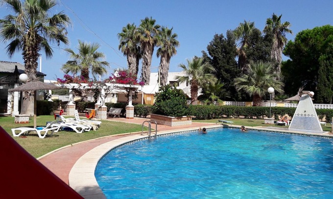Alcossebre Apartment | Beachfront Apartment in Alcoceber with Pool, Jacuzzi, and Garden
