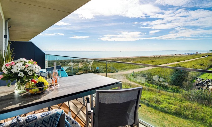 Olpenitz Apartment | "BeachWaveThree": Holiday apartment right on the beach with sauna, balcony & Baltic Sea view