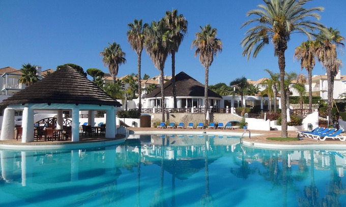 Almancil Apartment | Beautiful 2 Bed Apartment with Private Garden, Large Palm Fringed Communal Pool