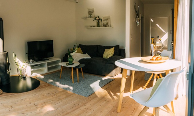 Handeloh House | Beautiful vacation home in ecological timber construction in the Lüneburg Heath, equipped with fireplace, shower room, a beautiful garden with terrace and garden furniture/beach chair, Internet via W-Lan, bed linen and towels, spacious sleeping area and a