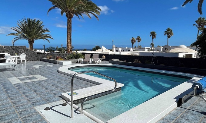 Los Pocillos Villa | Beautiful Villa with sea view and heated pool, prime location in Lanzarote.