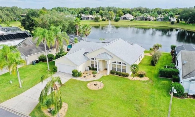 Sunridge Woods House | Beautiful waterfront home with heated pool and game room.