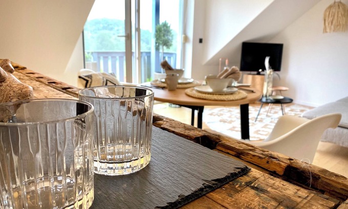 Losheim am See Apartment | BioLoft by the lake and distant views. Cozy vacation apartment on the top floor