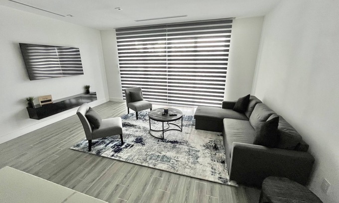 Nassau Condo | Blu at Villa Nova. Stylish Modern Condo, Minutes away from the Beach.