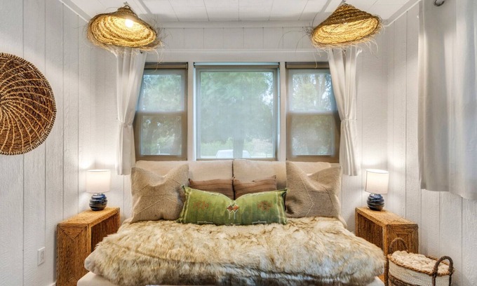 Montauk Apartment | Bohemian-style hotel unit with ample natural light, a cozy seating area,.