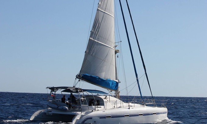 Vlychada Boat Rental | Catamaran cruise with skipper and hostess
