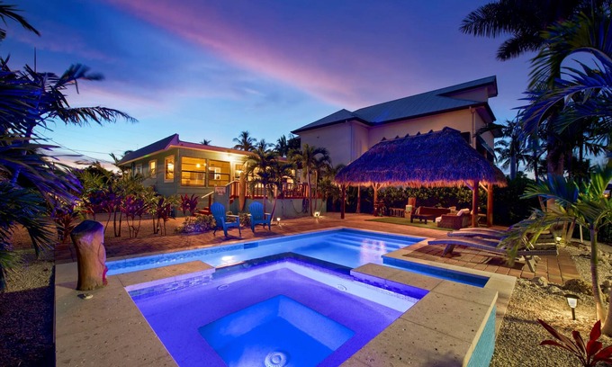Fort Myers Beach House | Charming 2-Bed Home with Pool, Tiki Hut, Canal Access, & Steps to Beach & Dining