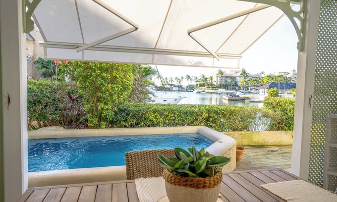 Douglas Villa | Charming 2-brm WATERFRONT Villa with WiFi, AC, & Pool in PORT ST CHARLES MARINA!