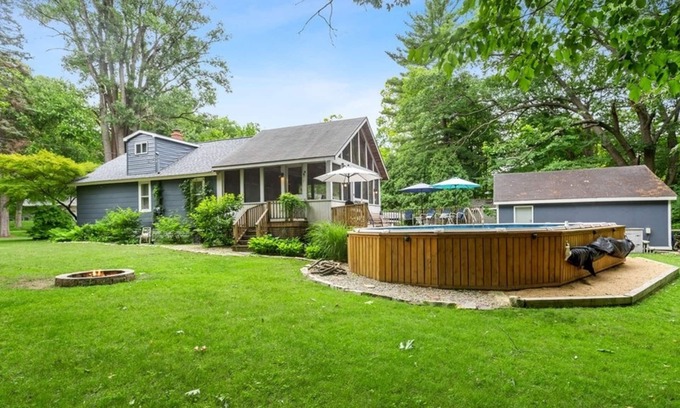 New Buffalo Cottage | Charming cottage with fast WiFi, fire pit, above-ground pool, & huge sunroom