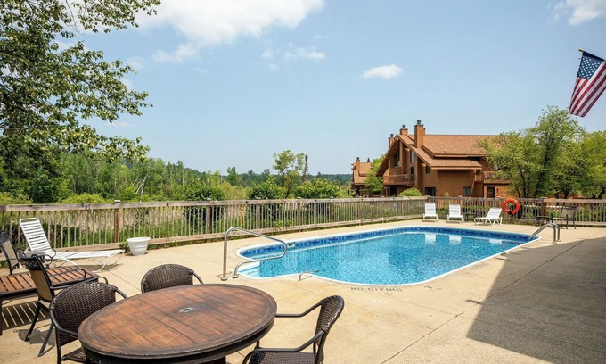 Bellaire Condo | Charming sleeps 6, 2 bath steps to golf, Enjoy fall colors on your deck!