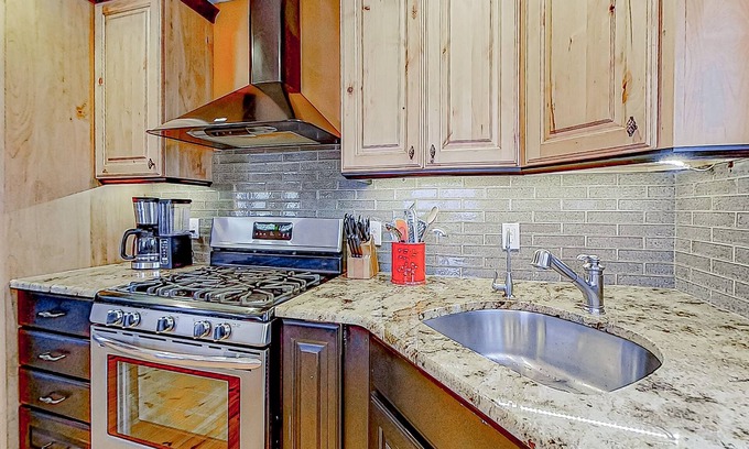 Alton Bay House | Charming & sun-filled nature escape with large deck, wood stove, fire pit, & W/D