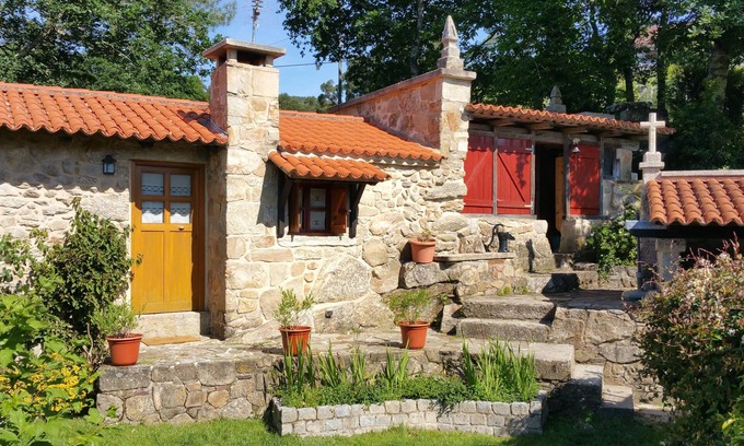 Poio Cottage | Charming traditional stone cottage nestled in the woods minutes from coast