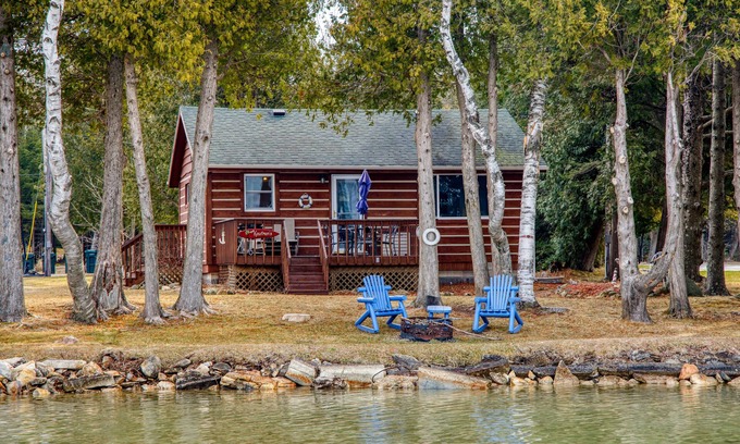 Sturgeon Bay Cottage | Charming Waterfront Cabin on Clark Lake- paddleboat and canoes!