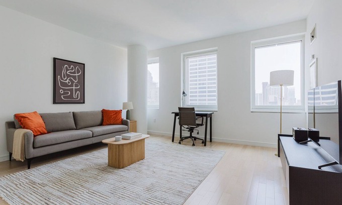 Central New York City Apartment | Chic Midtown 2BR w/Gym, W/D & A/C, near Rock Ctr, by Blueground