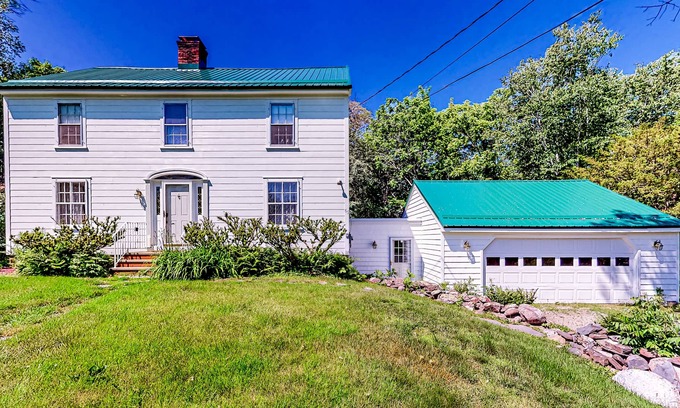 Orono House | Classic waterfront retreat with a grill, firepit, four bedrooms, W/D, and AC