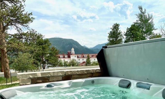 Stanley Hills Condo | Condo w/ breathtaking views of the Rockies, patio w/ outdoor hot tub! #311