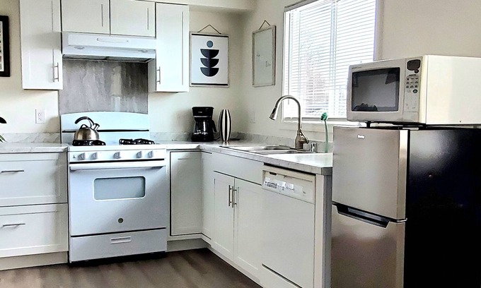 Sand Lake Apartment | Corner studio with full kitchen, 800 sq ft- Sunny views include Mt. Susitna