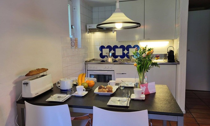 Capriasca Apartment | Cosy apartment for 5 people with WIFI, pool, TV, patio and pets allowed