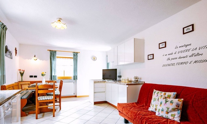 San Giovanni di Fassa House | Cosy apartment in villa for 4 guests with WIFI, TV, balcony, pets allowed and parking