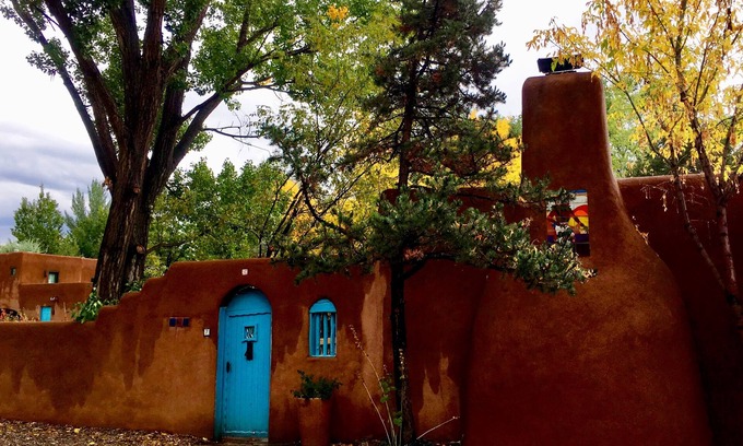 Taos Condo | Cozy Casa Carmelita features a Brilliant Kiva Fireplace, Unique Patio & Hot Tub!