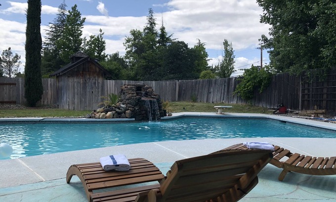 Midway House | Cozy mid century house with pool, hot tub, Dish Tv, WiFi, fireplace, waterfall