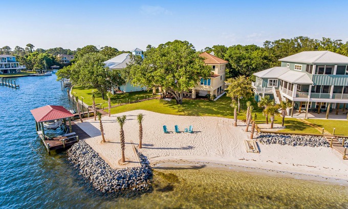 Gulf Breeze House | Delightful escape on the sound with beach access, dock, furnished deck, and WiFi