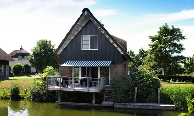 Makkum Cabin | Detached fisherman's villa with sauna, bathtub, and patio above the water at Beach Resort Makkum on the IJsselmeer.