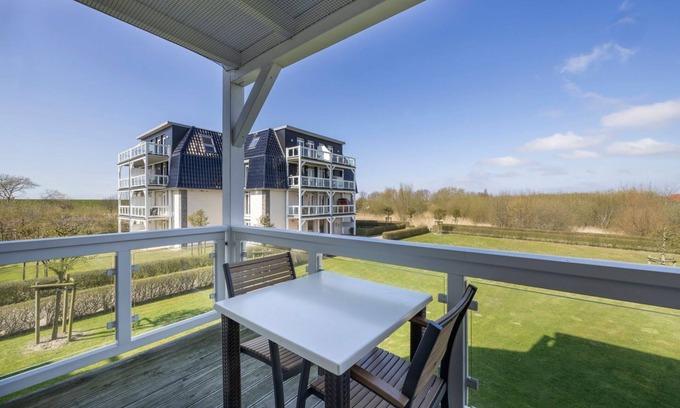 Wremen Apartment | Dog-friendly vacation apartment near the beach with sauna and balcony with beach chair -