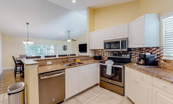 Bonita Springs House | Dog-friendly home with fenced yard, screened lanai, hot tub, & ping pong