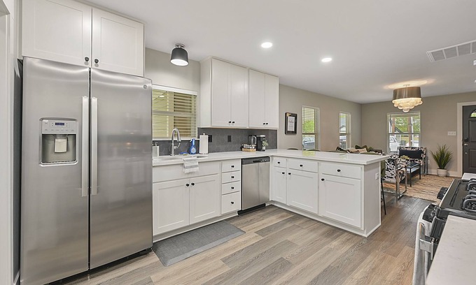 Bryan House | East 27th Bungalow 2 BR, 1 BA, Fully Remodeled, Large Yard and Covered Patio